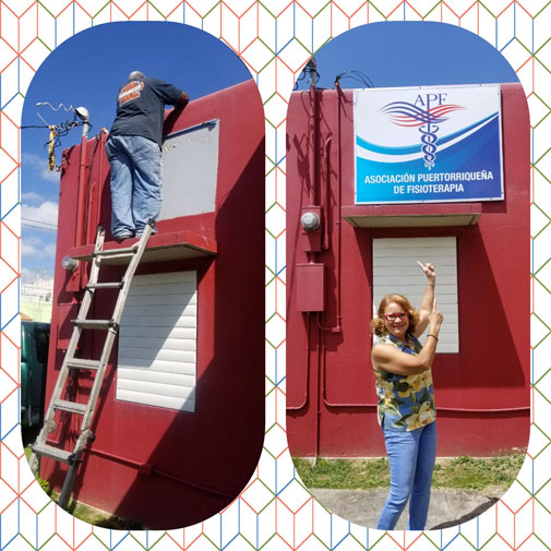 A man stands at the top of a ladder and a woman stands in front of a red building